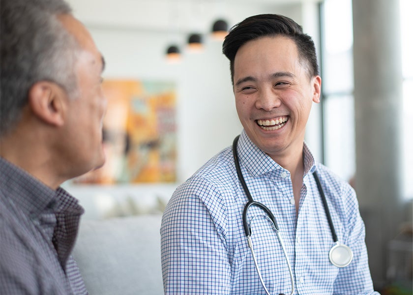 doctor laughing and smiling with patient