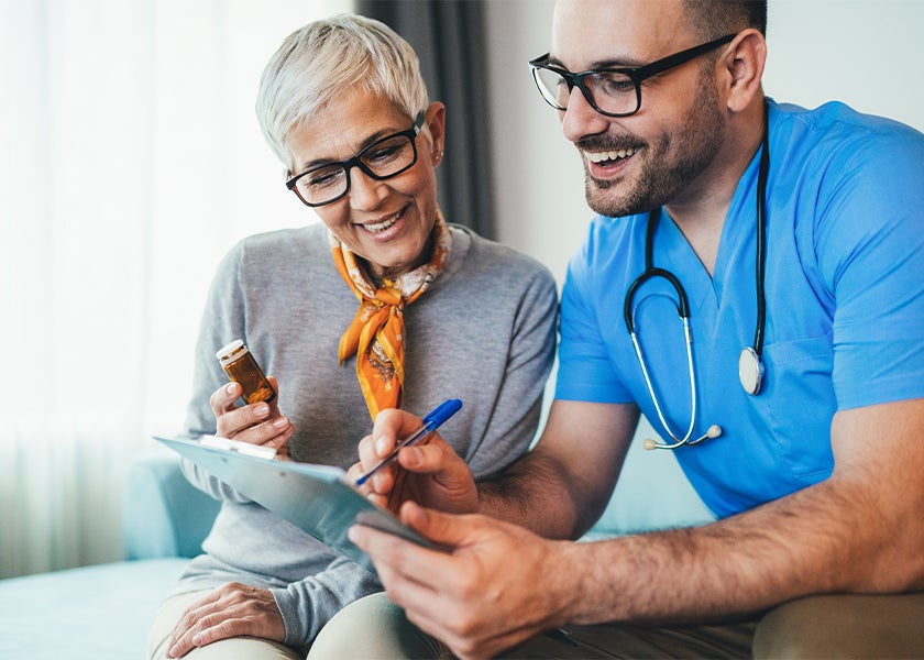 doctor talking and smiling to patient