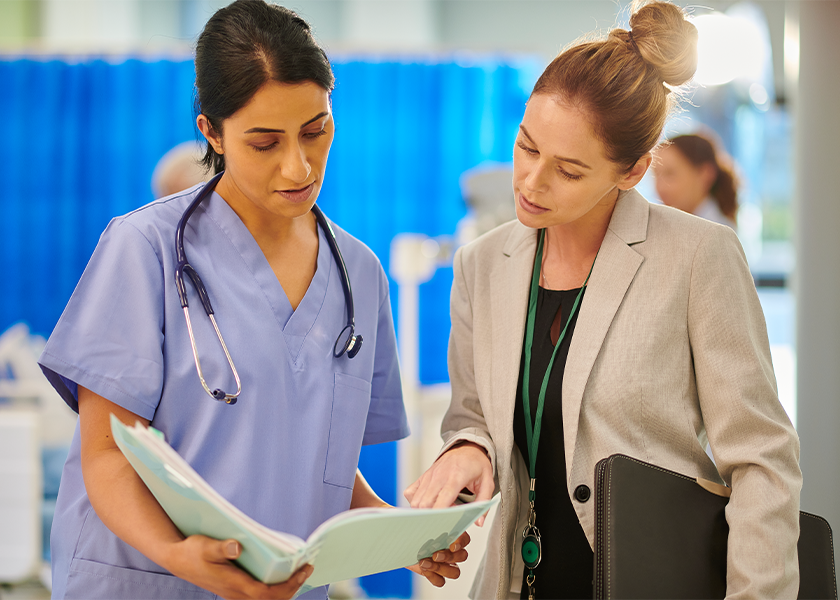 doctor talking to nurse