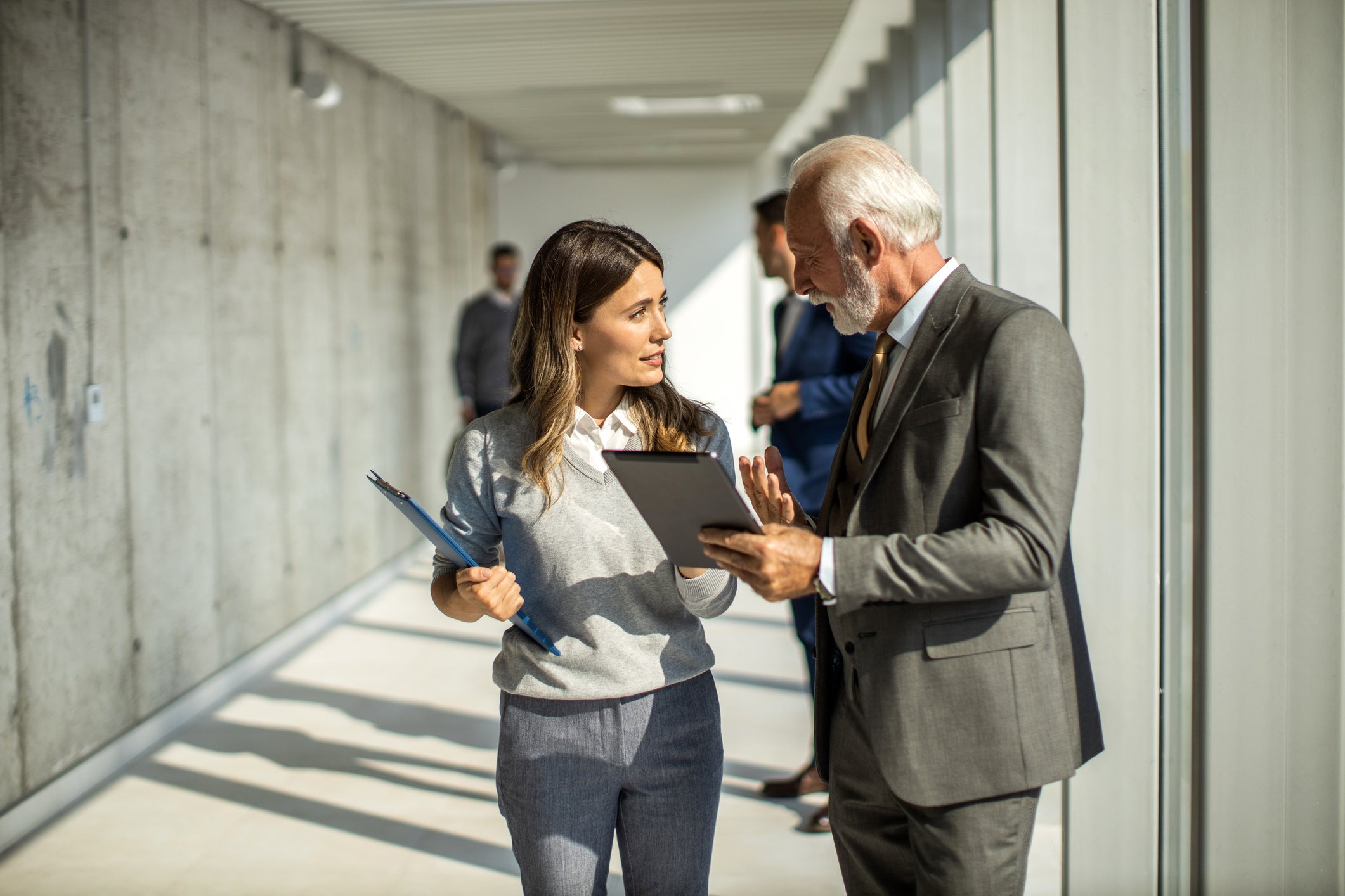 Doctor and supervisor talking in corridor