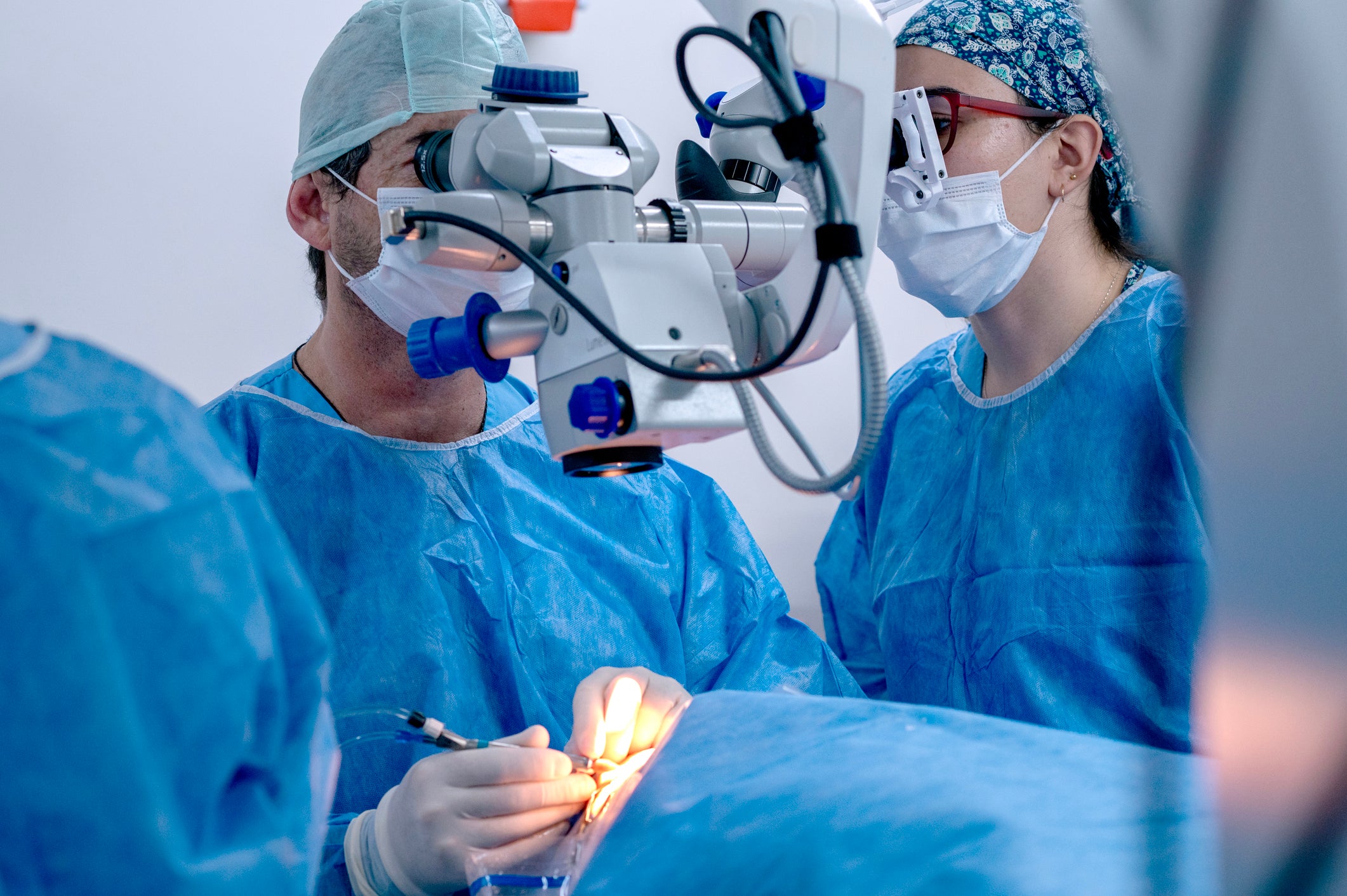 surgeons performing eye surgery 