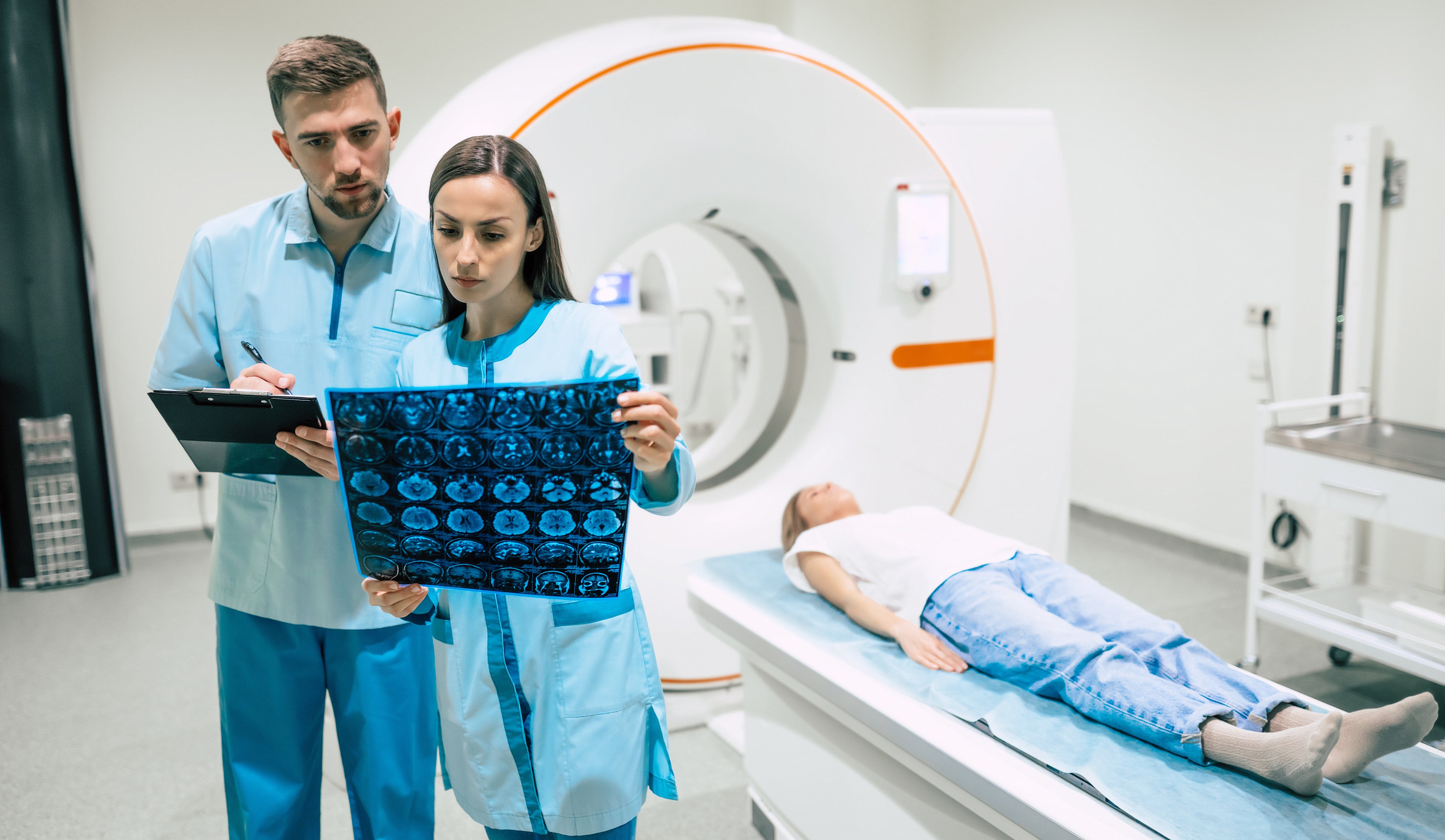 Two doctors looking at scans.