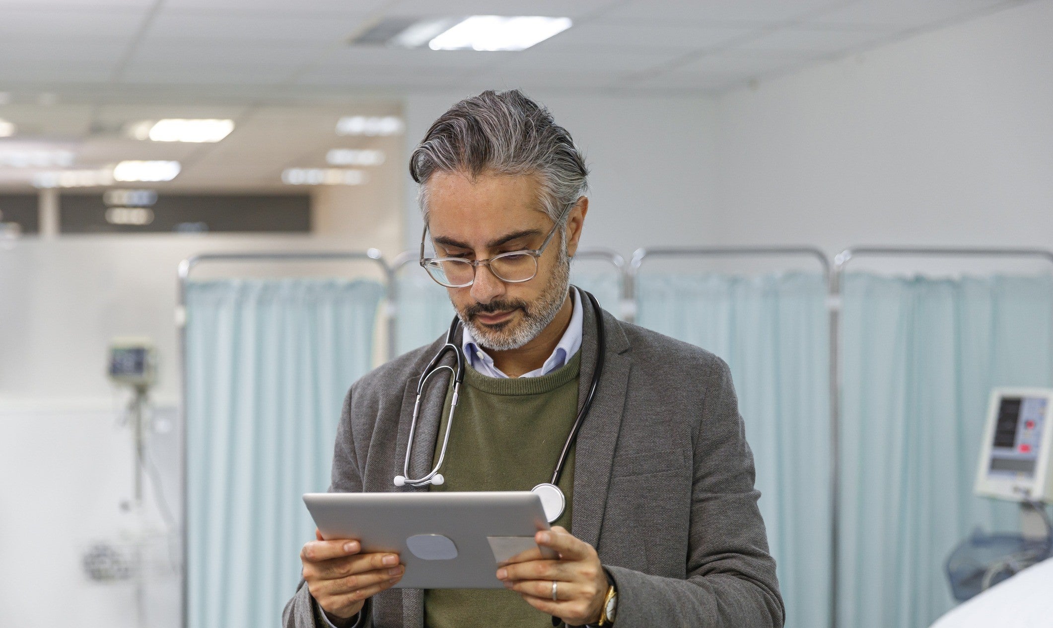 Doctor with ipad in hospital 