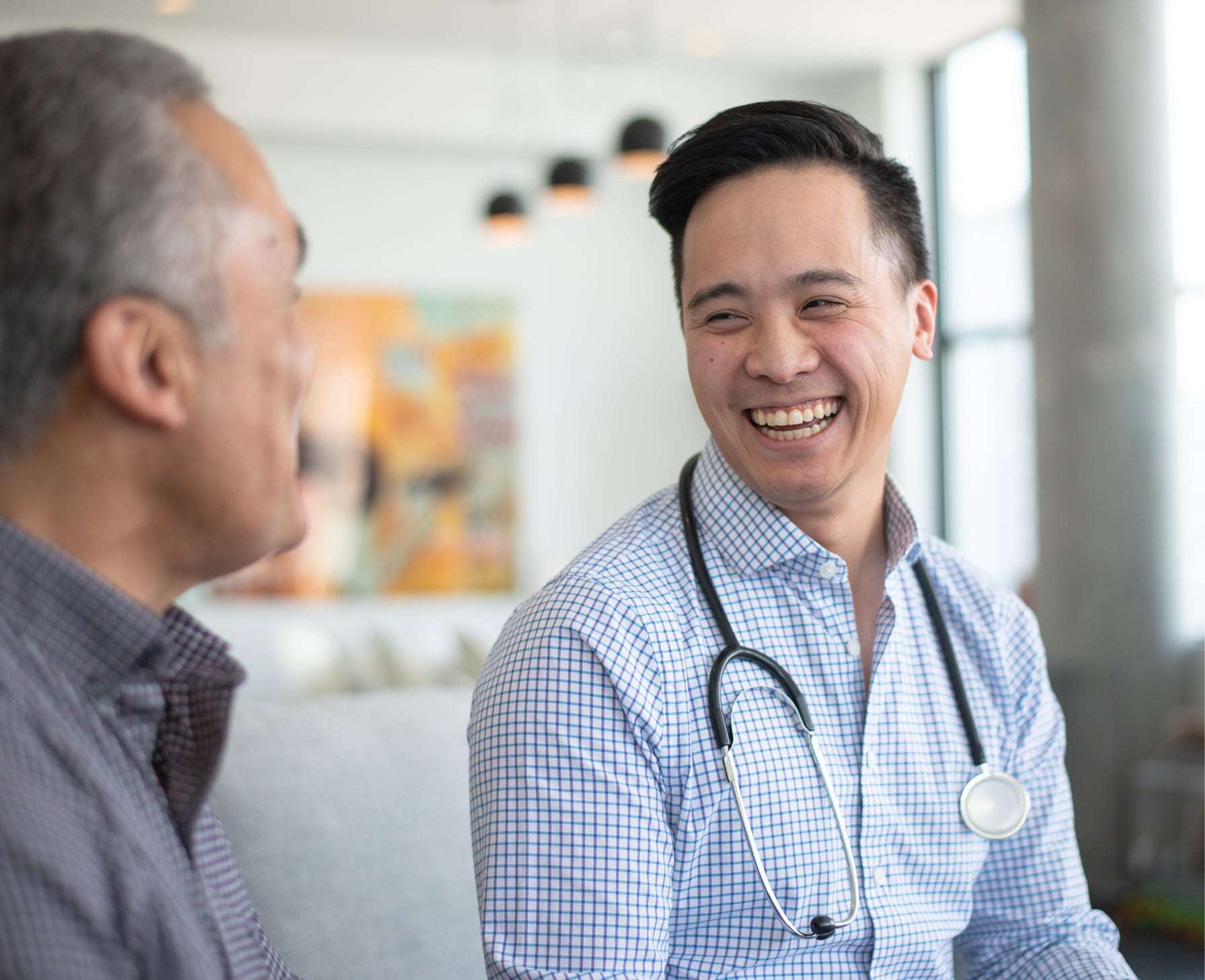 doctor laughing and smiling with patient