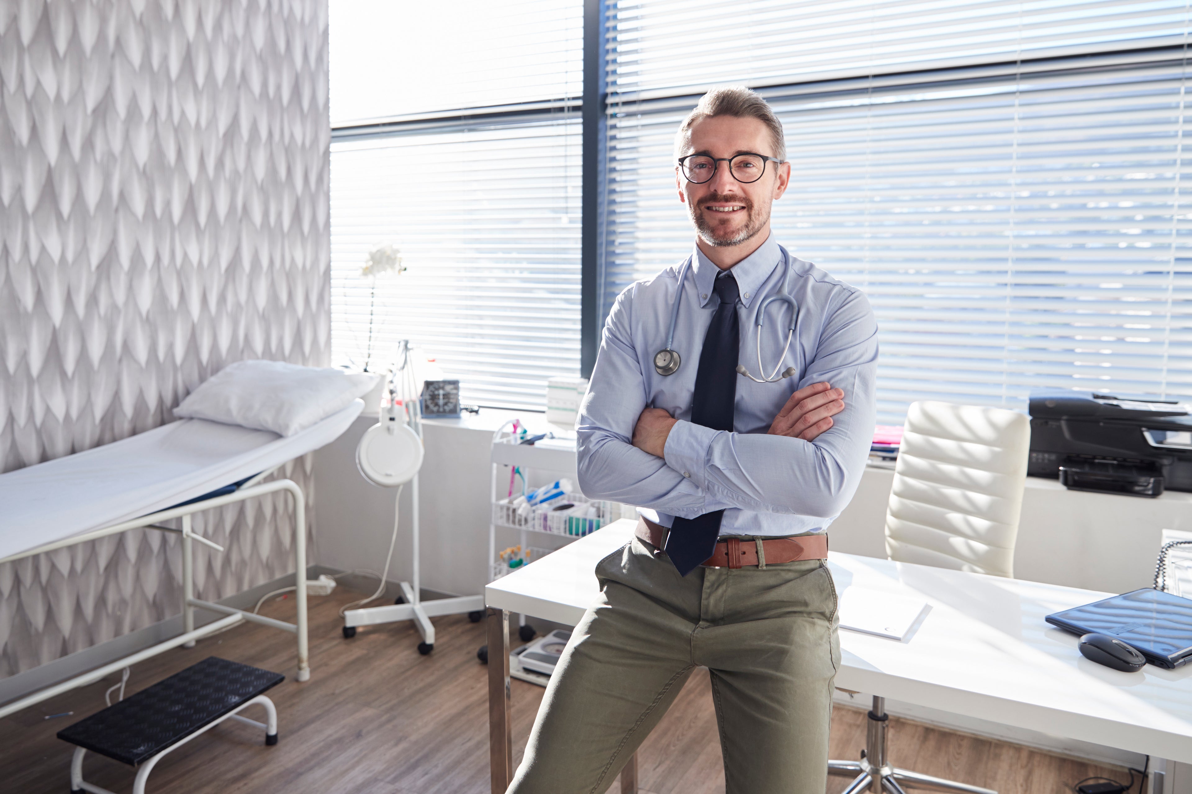 Male doctor in medical practice room.