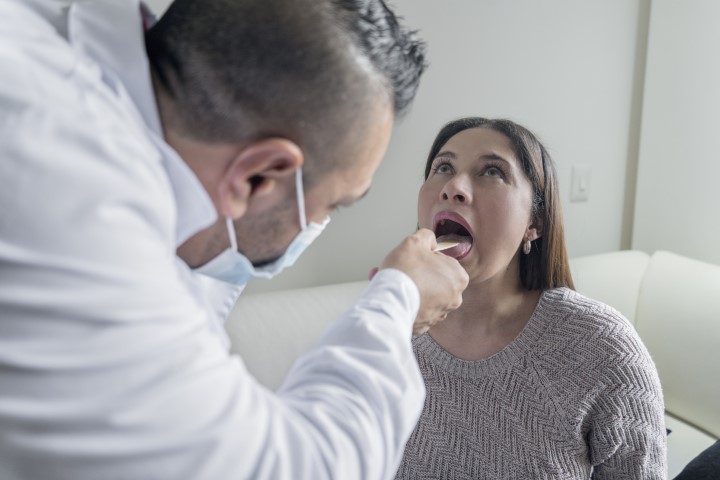 Doctor performing patient examination