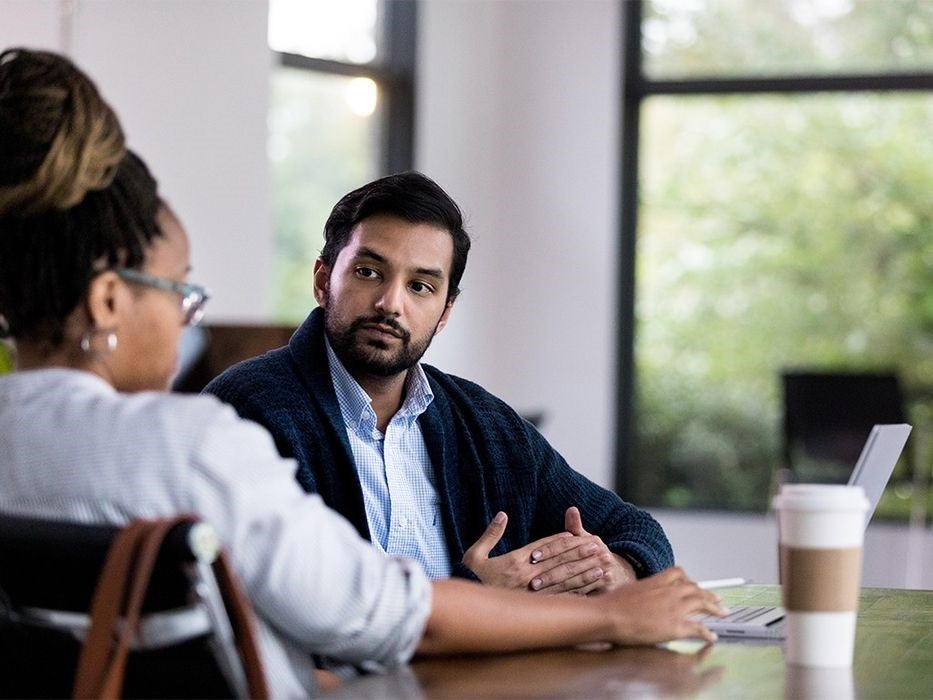 two people in conversation