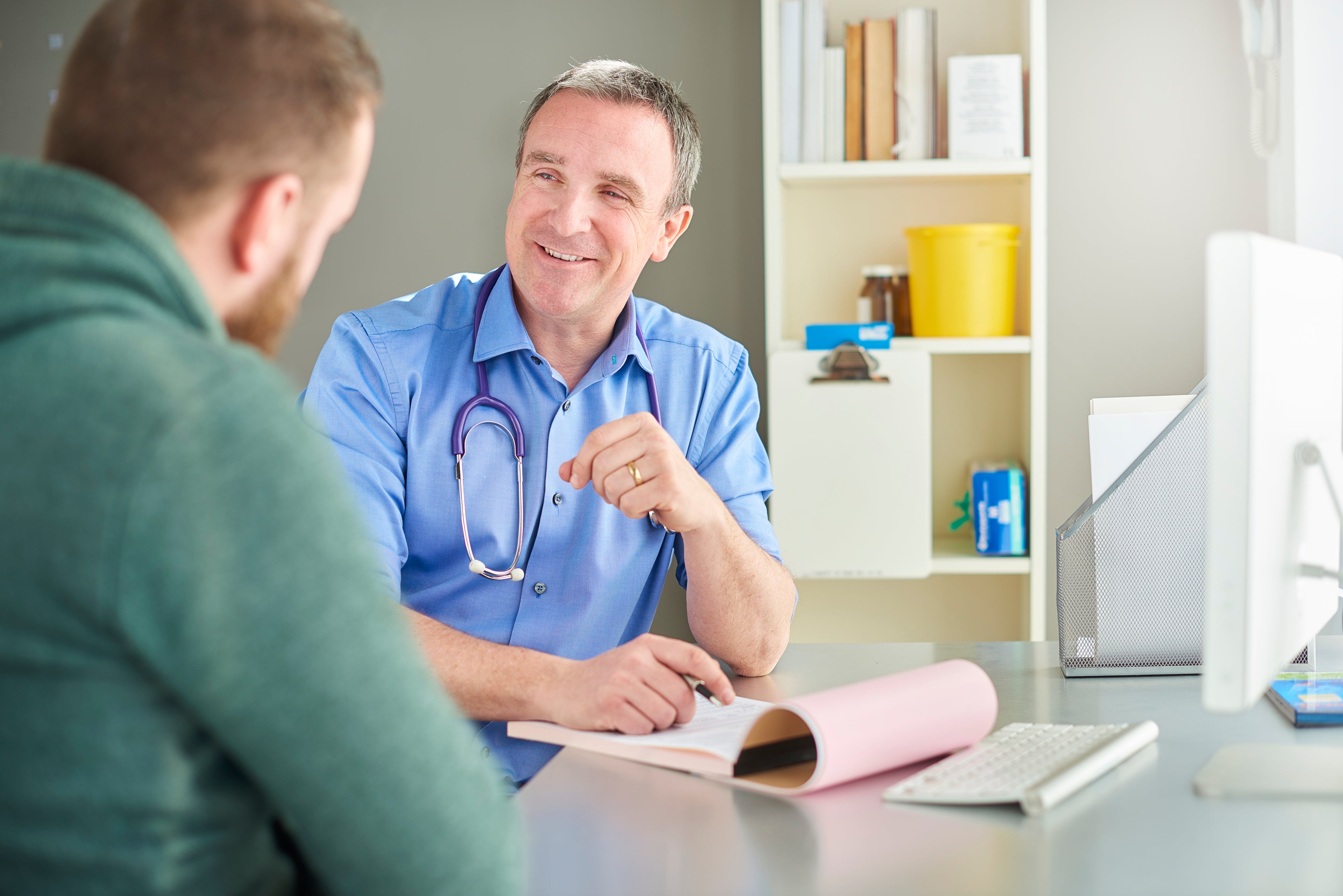 doctor talking with patient