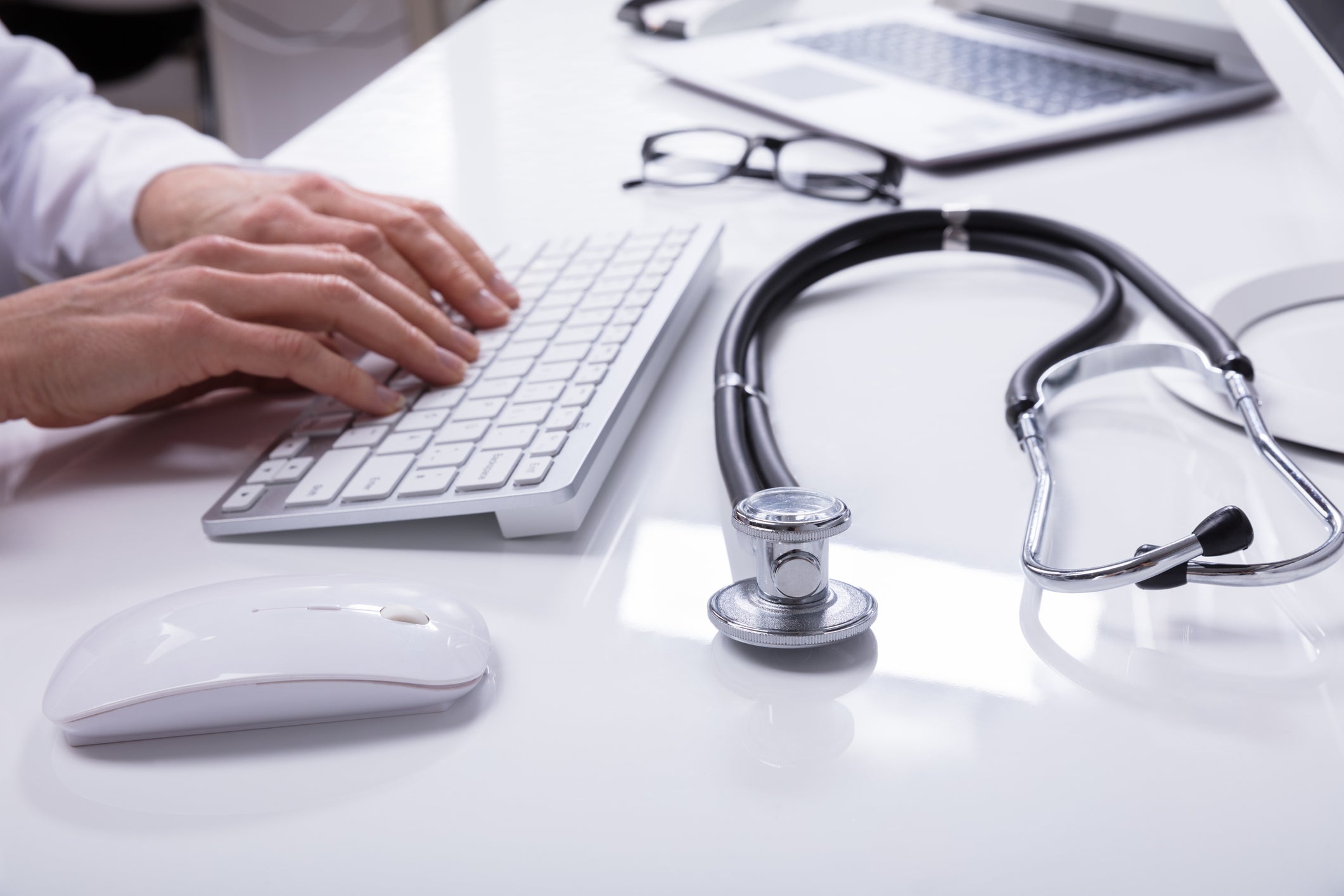 Doctors Hand Using Computer Keyboard