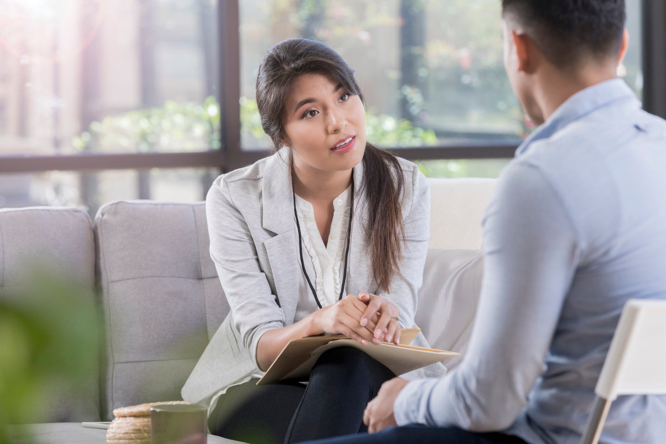 smiling woman listening to client