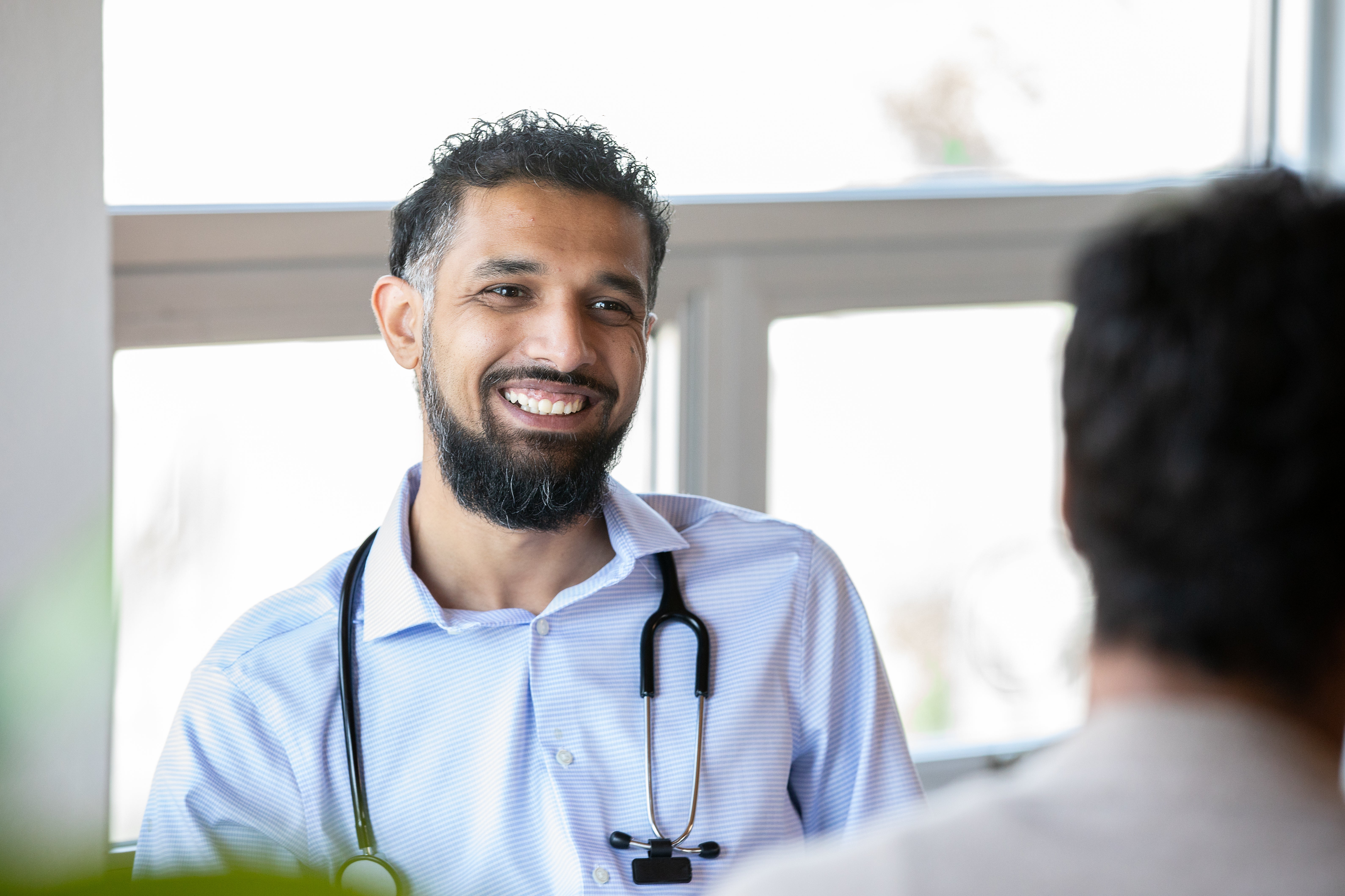 Doctor talking to a patient smiling