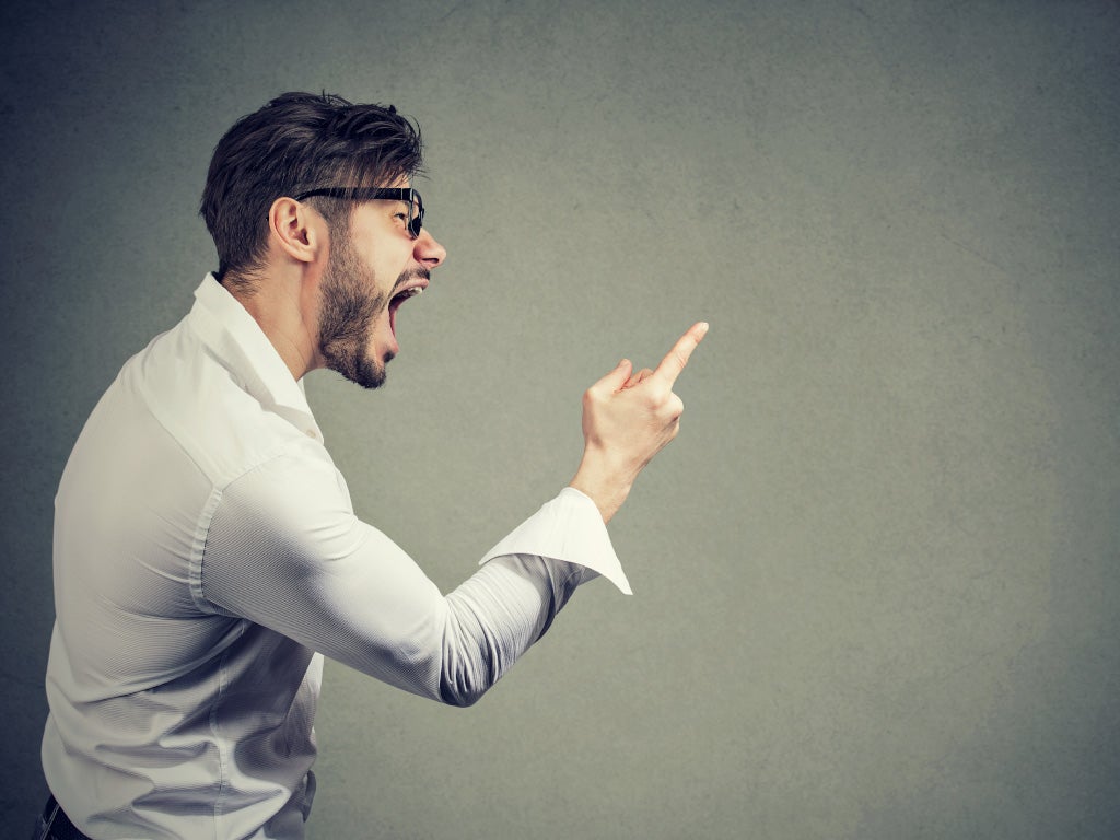 Man in black glasses yelling and pointing finger