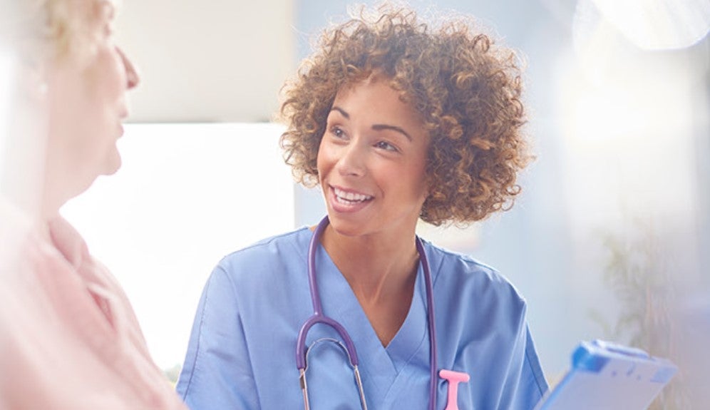 Nurse smiling at patient