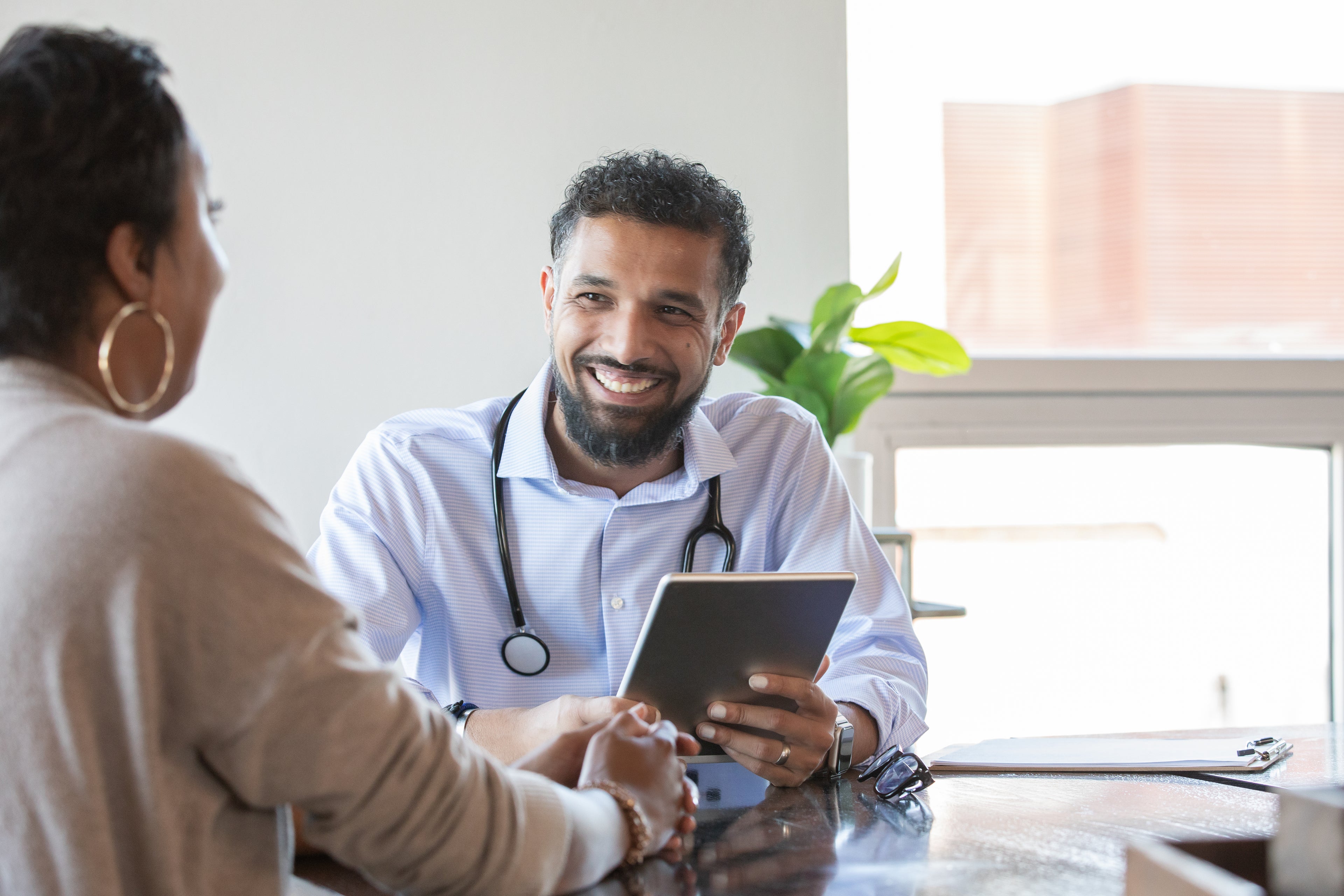 Life insurance adviser speaking with a client