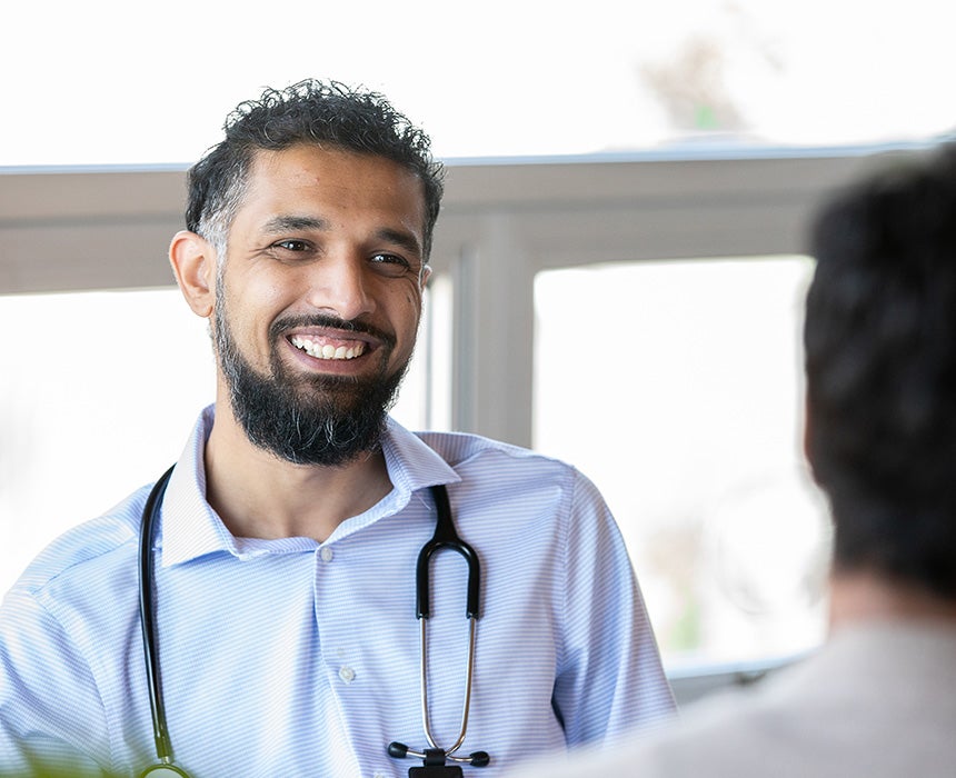 Doctor talking to a patient smiling