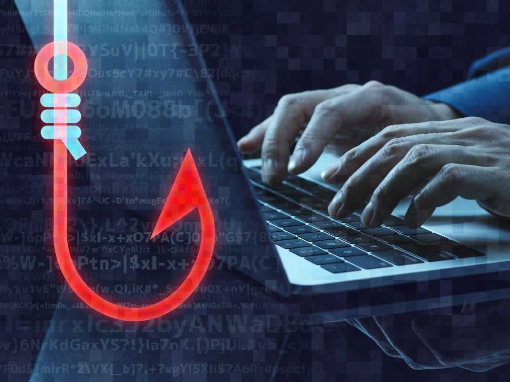 Graphic of a fishing hook in front of distorted hands typing on a laptop