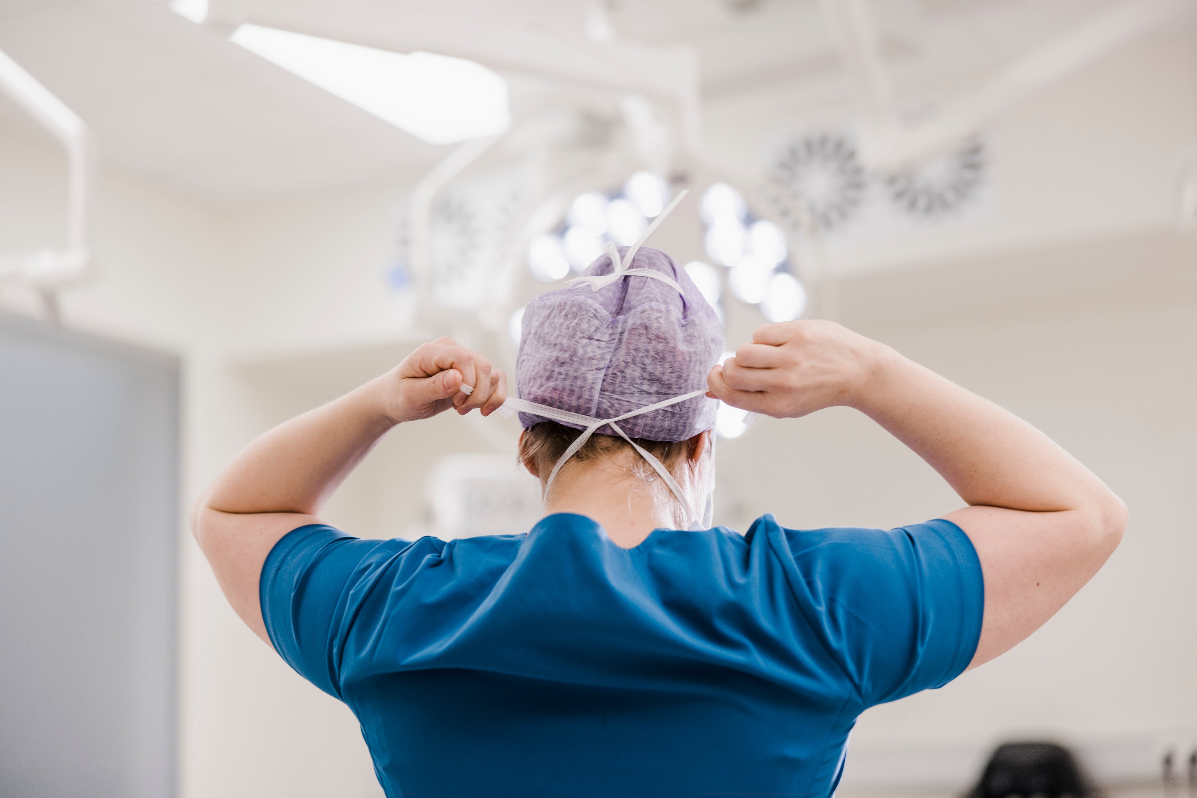 Doctor securing hair net