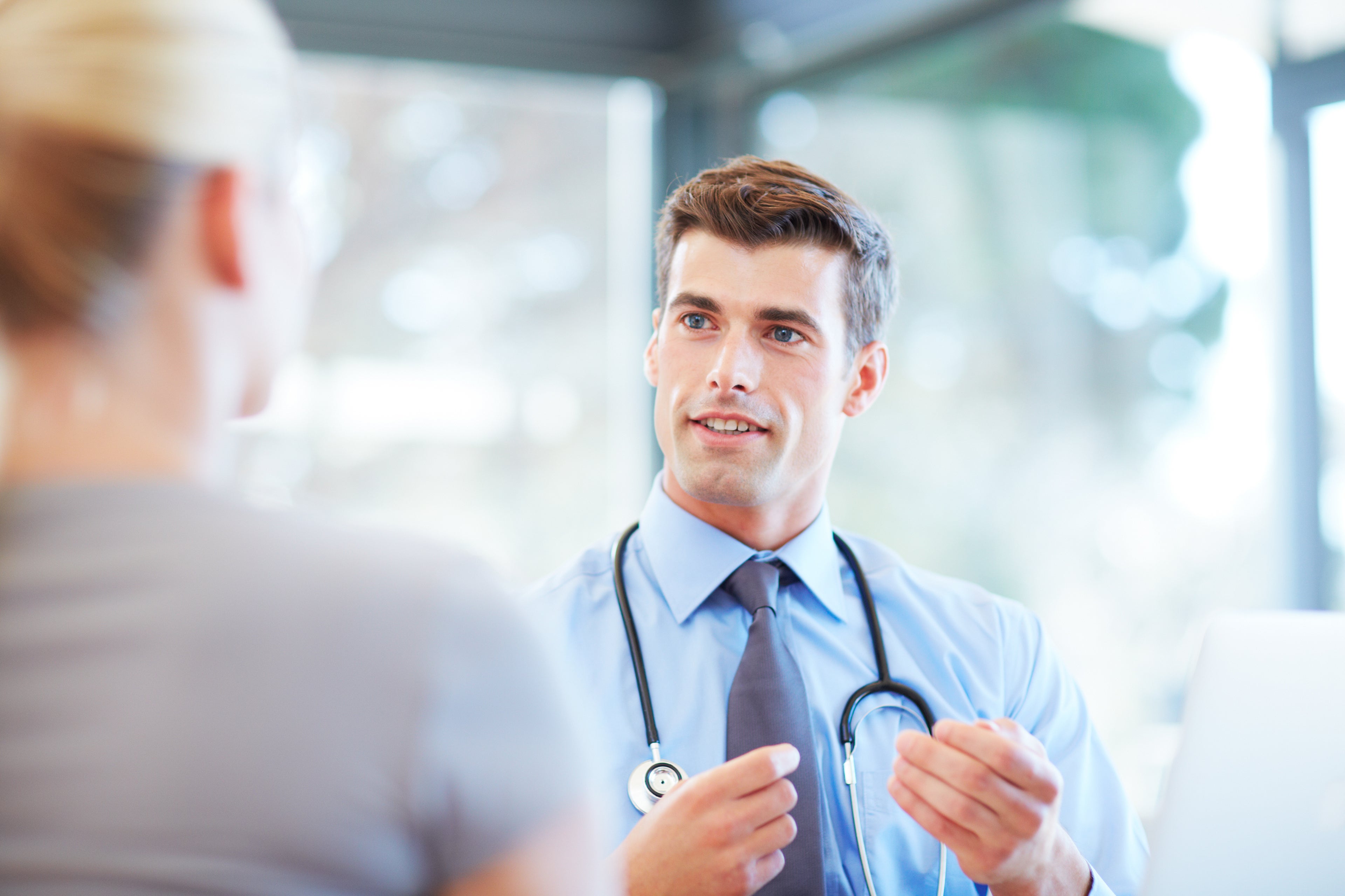 Male Doctor speaking with patient