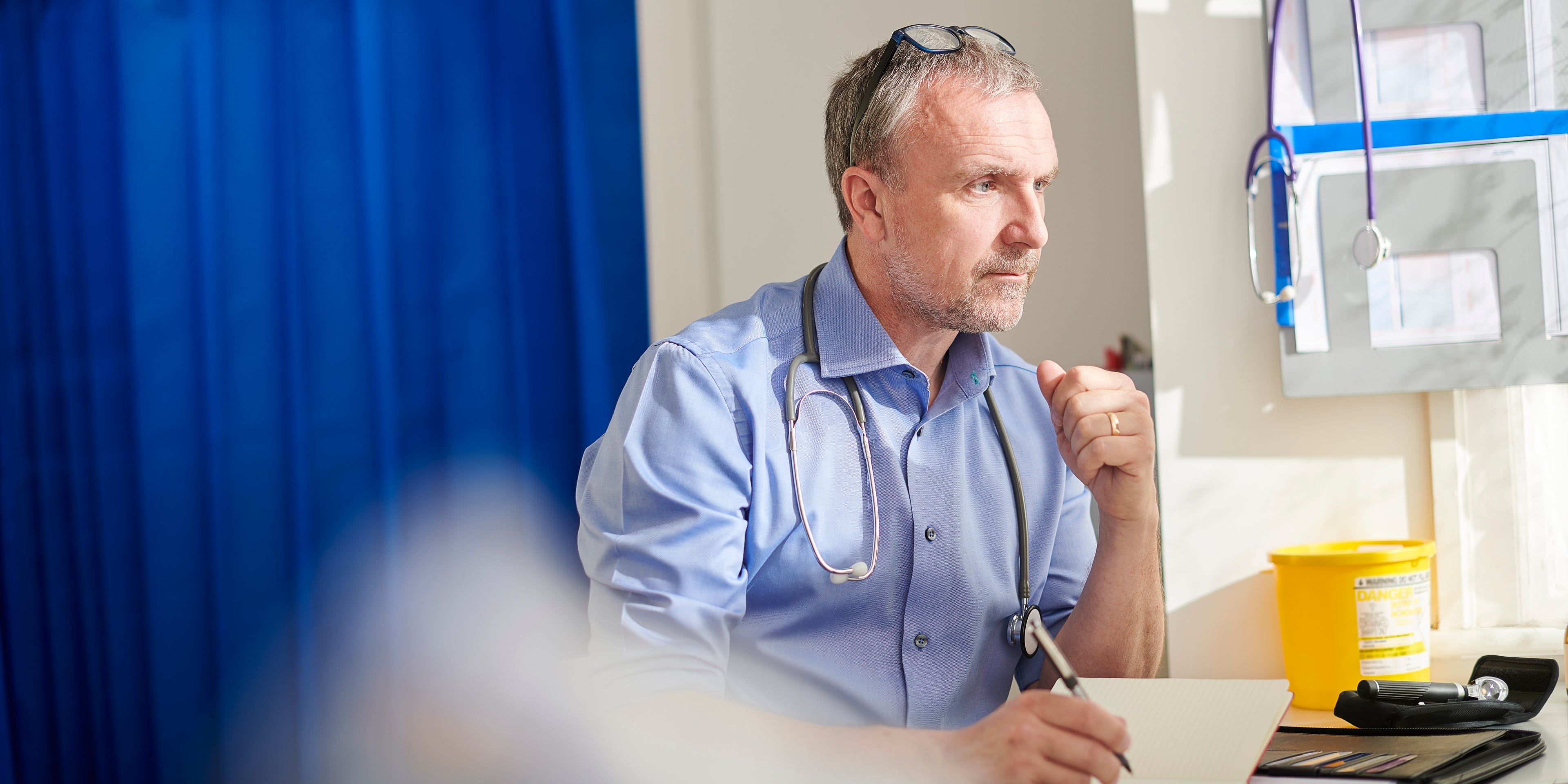 Doctor at desk in medical practice