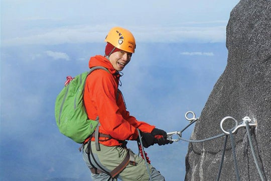 Man climbing mountain