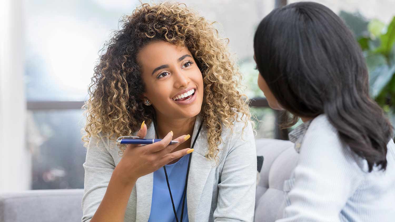 doctor speaking and smiling to patient