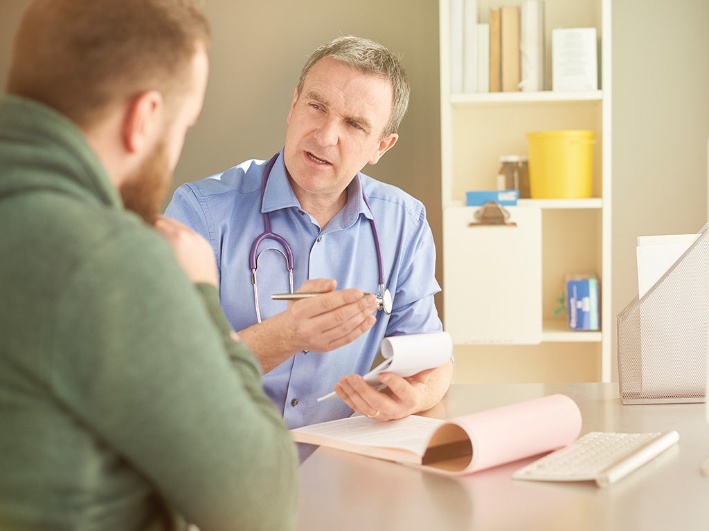 Doctor and patient speaking in office