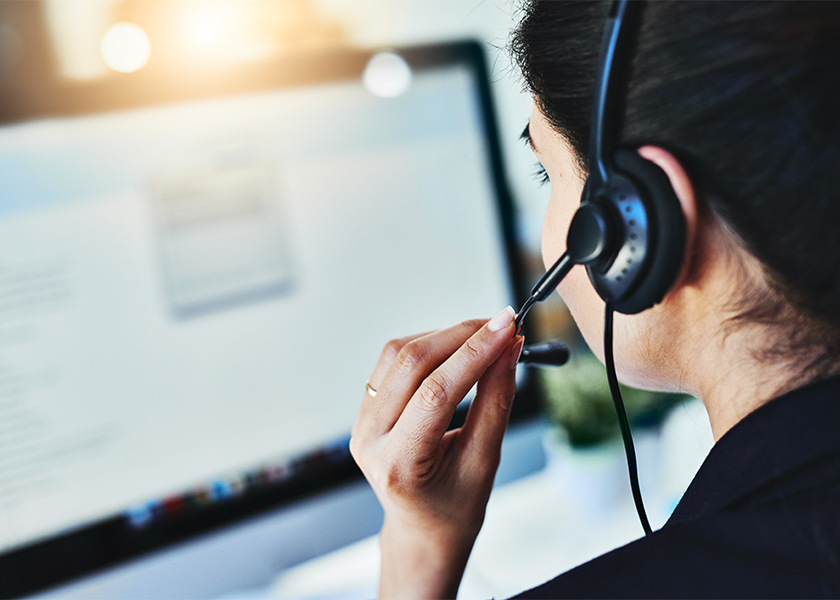 Person-with-headset-on-computer