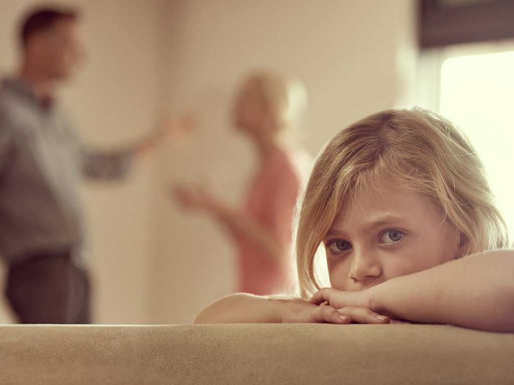 child in foreground looking at camera 