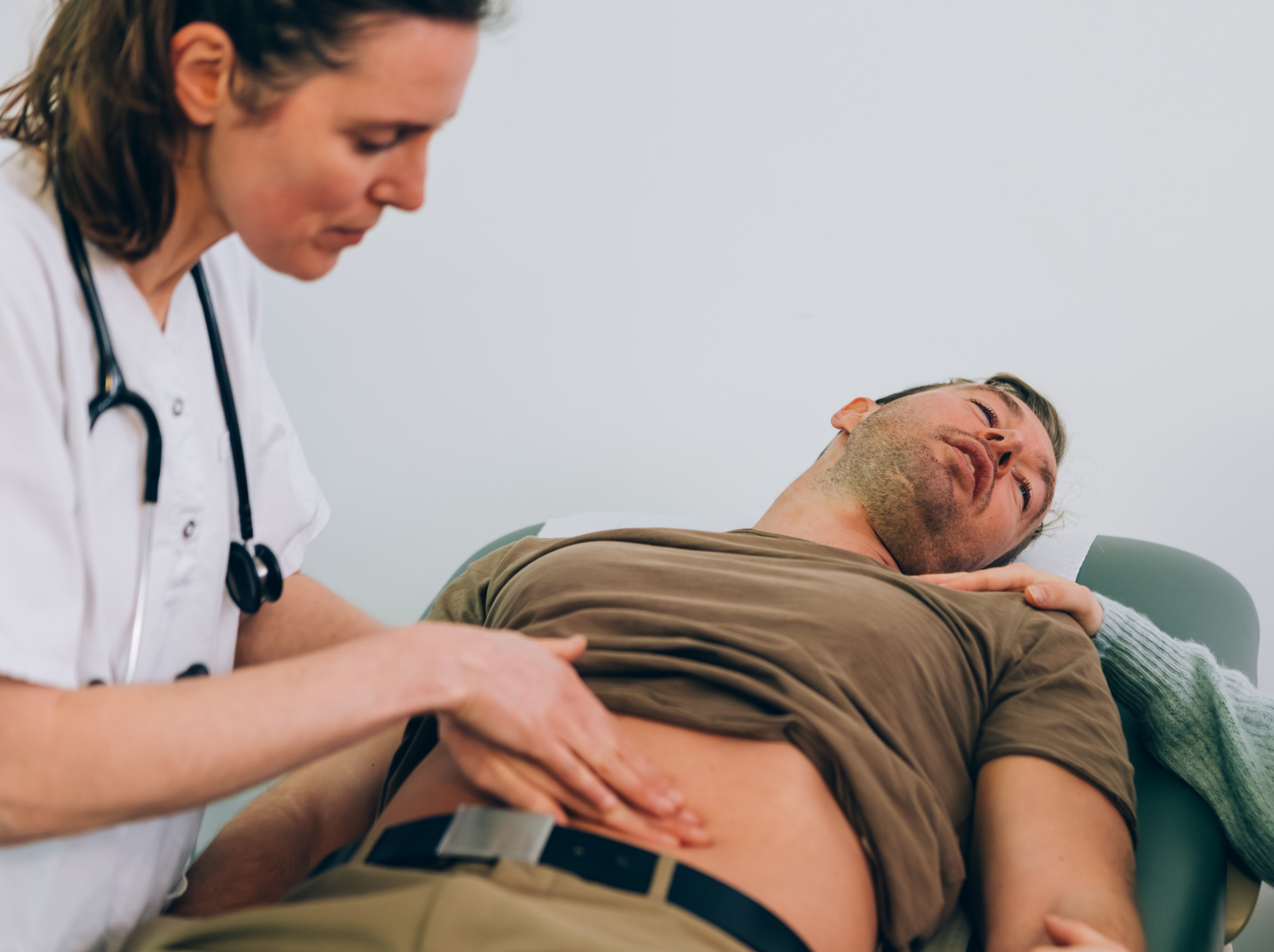 doctor assessing patient