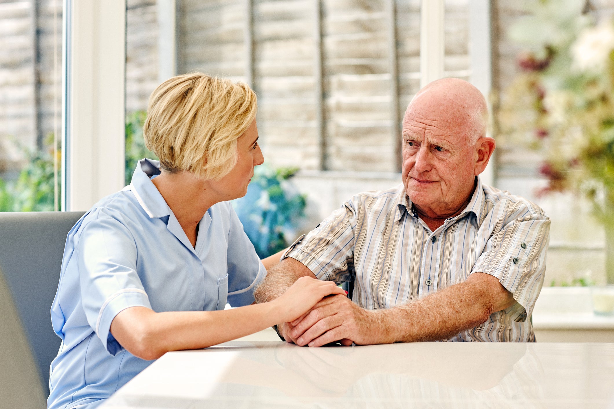 Doctor talking to an elderly patient