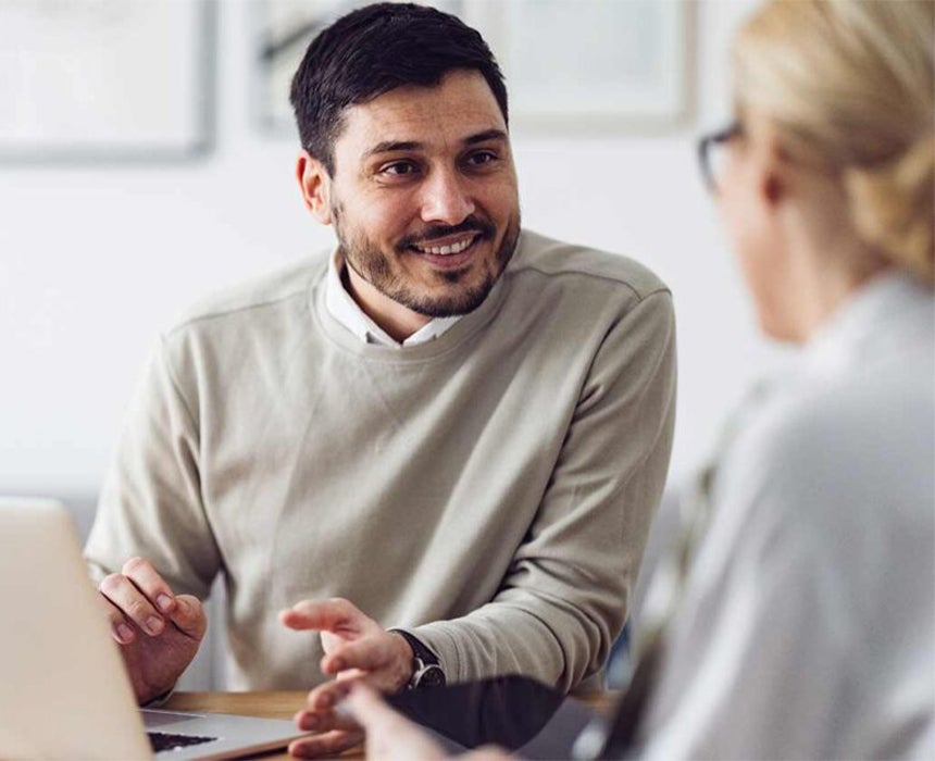 Man talking to woman