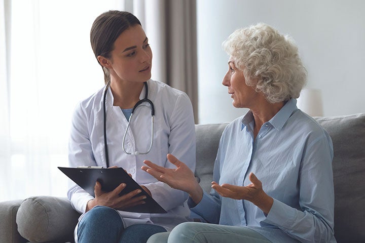 Doctor and patient talking on couch