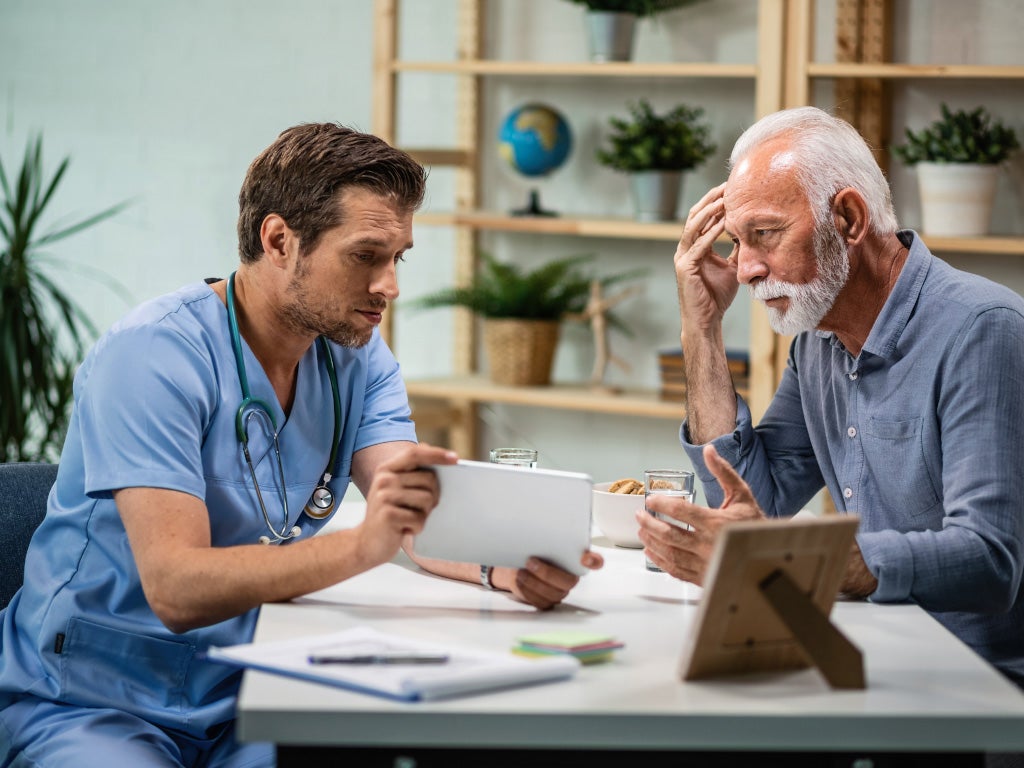 Doctor and patient sitting opposite each other