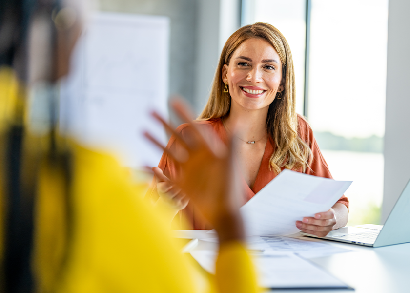 smiling woman listening to client