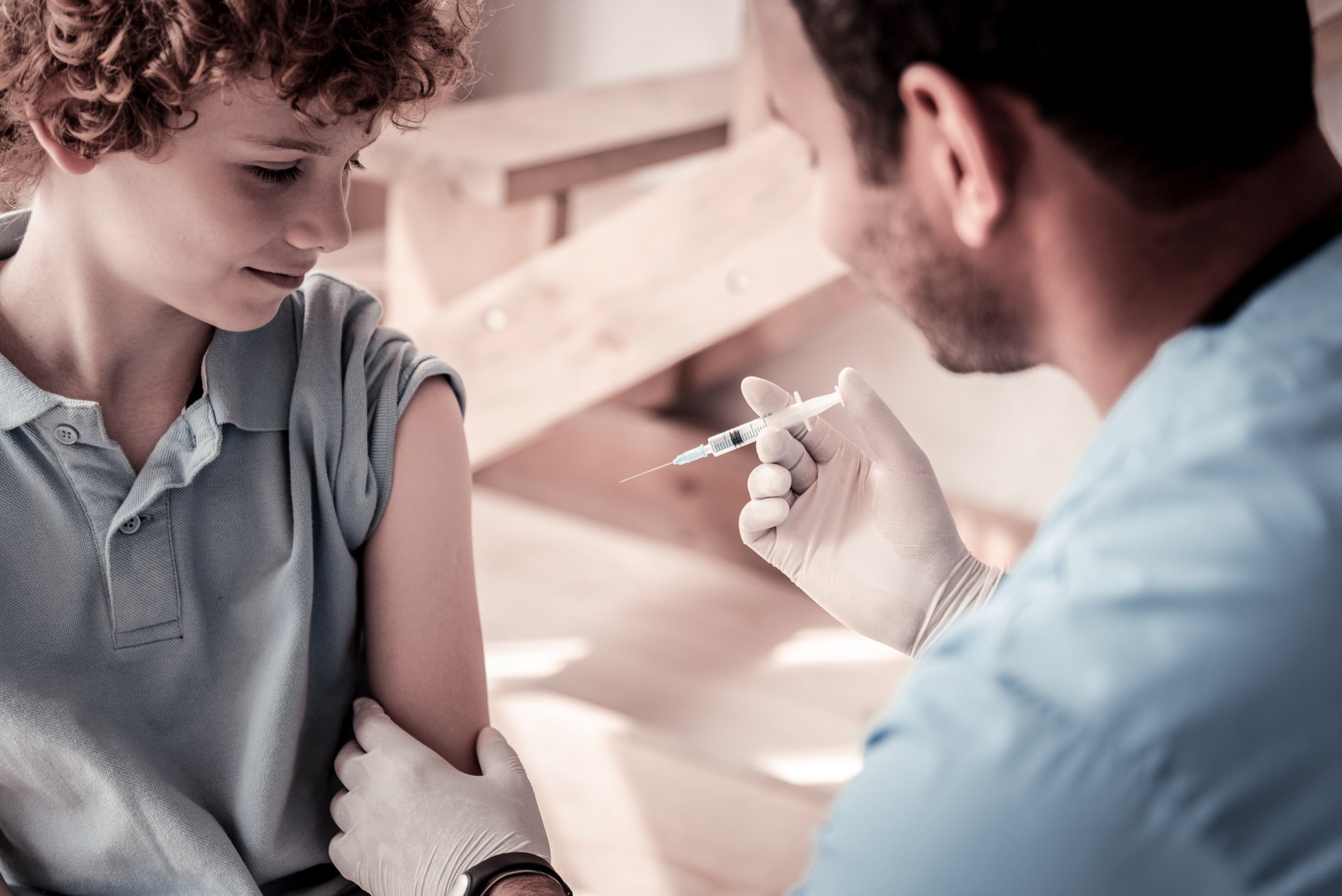 doctor vaccinating child