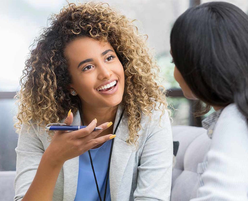 doctor speaking and smiling to patient