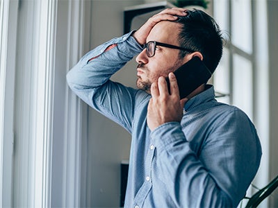 Person on phone looking out window