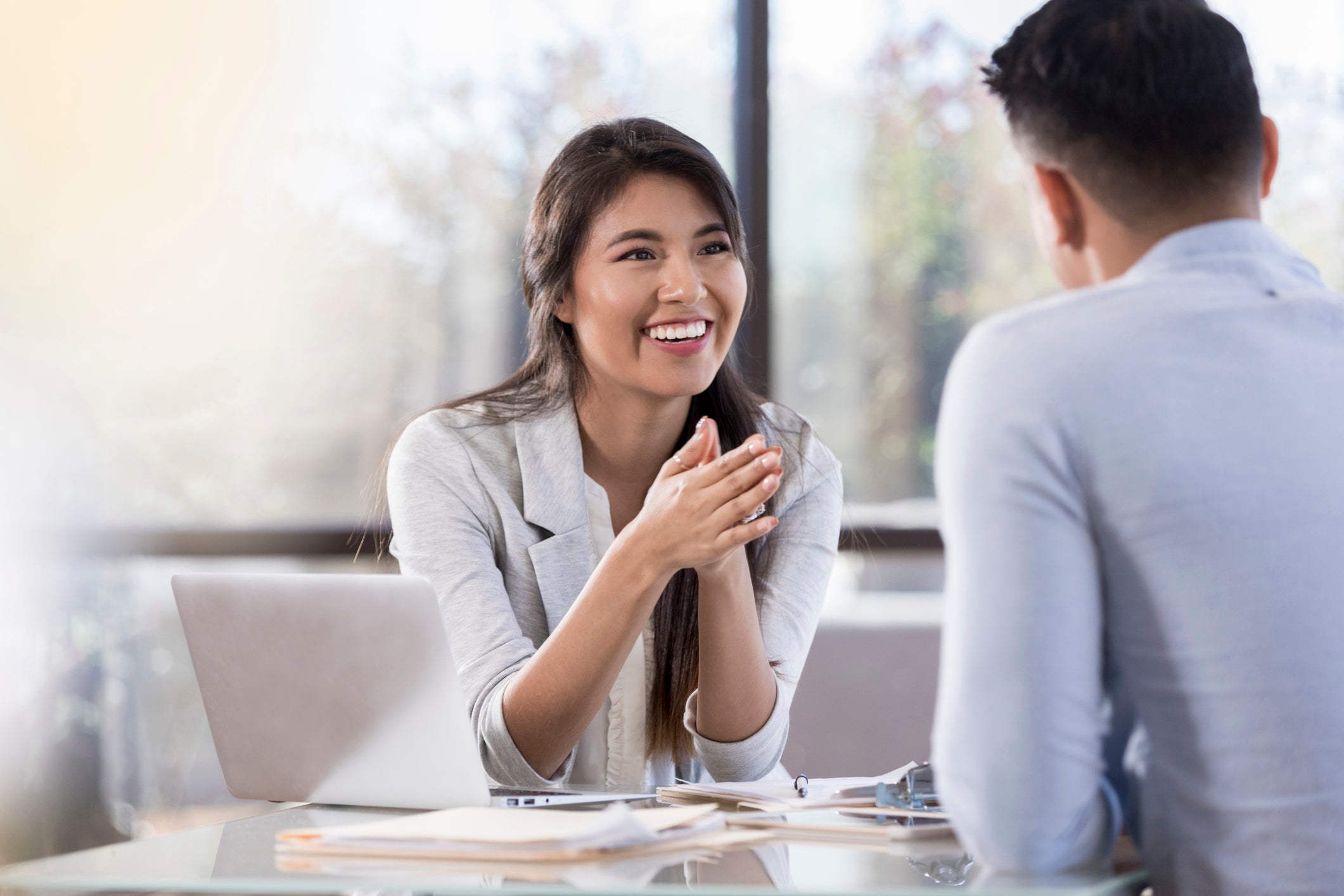 woman smiling and talking to a man