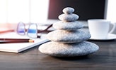 Desk with pebble ornament on the table