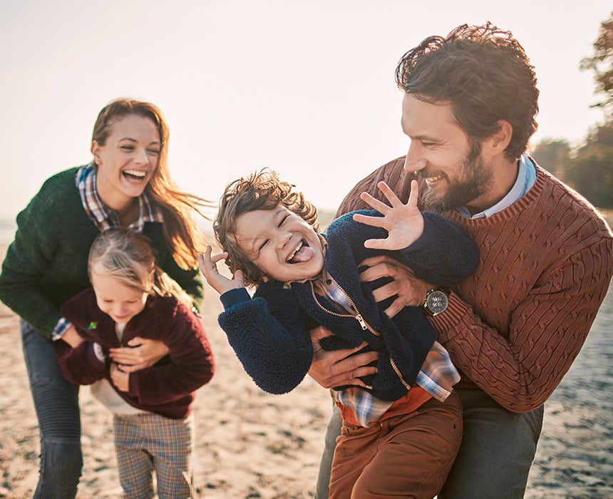 Family playing at the beach