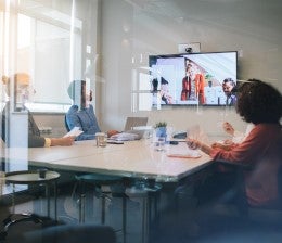 Meeting in person and online in a meeting room