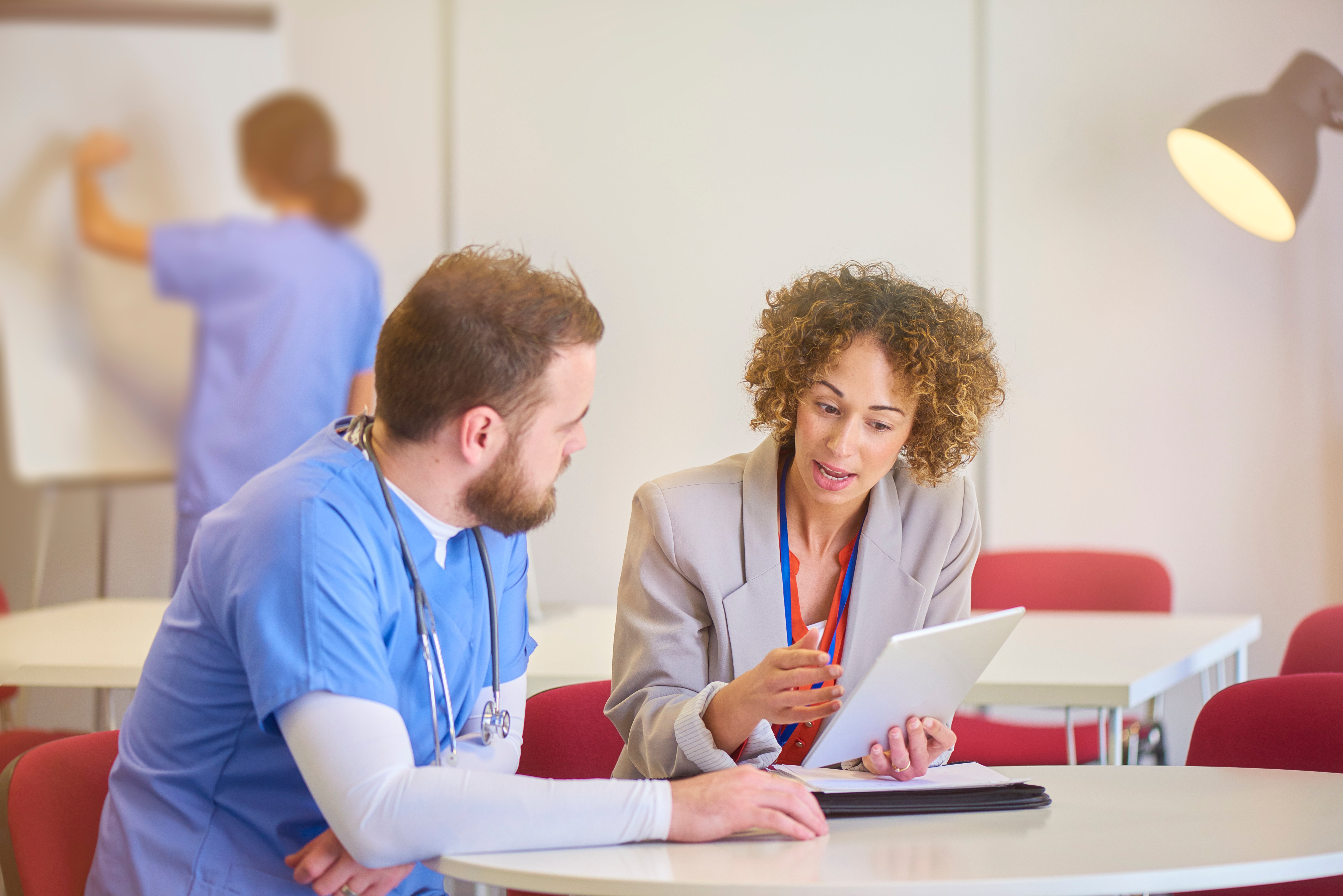 Doctor talking to nurse