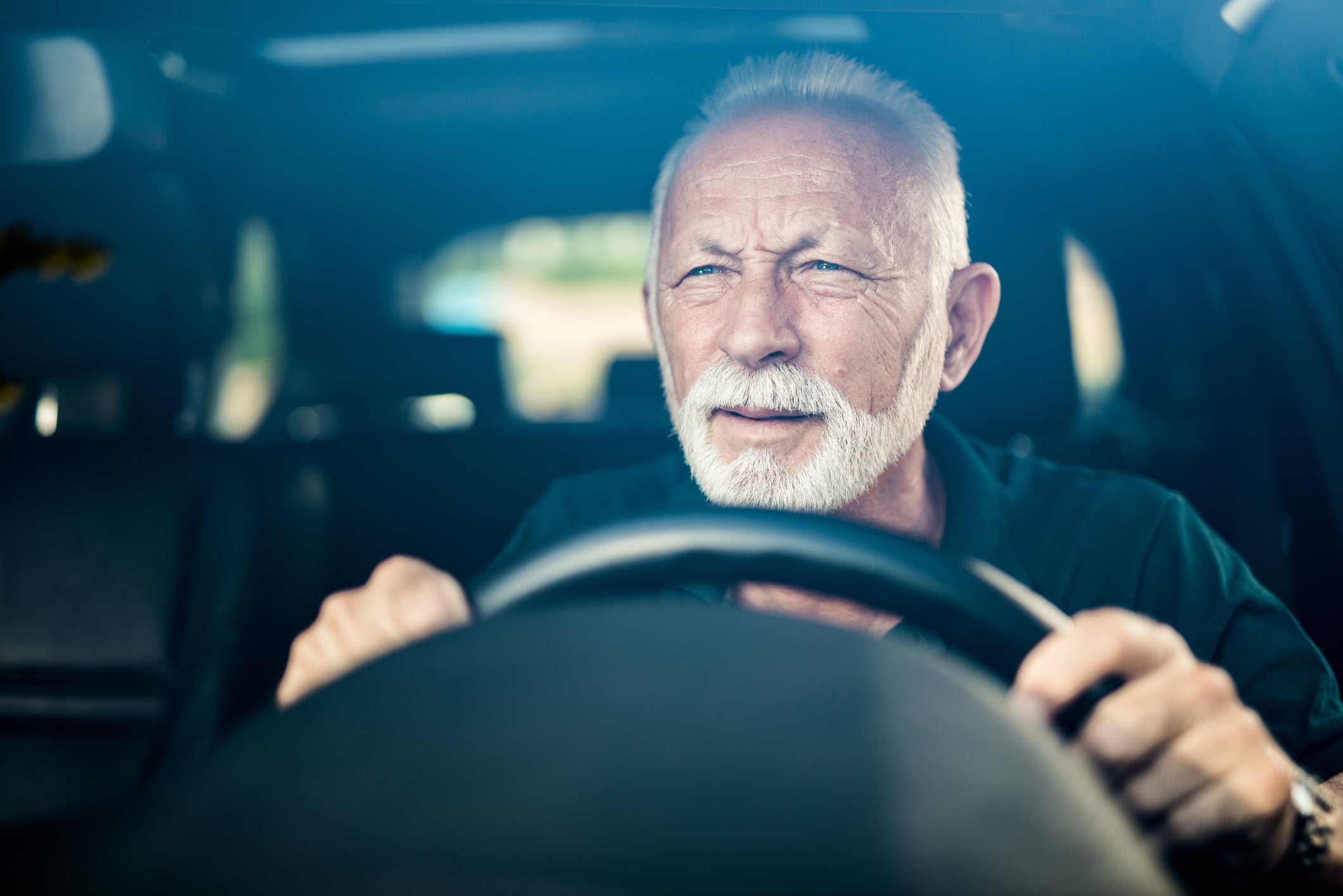 older man driving 