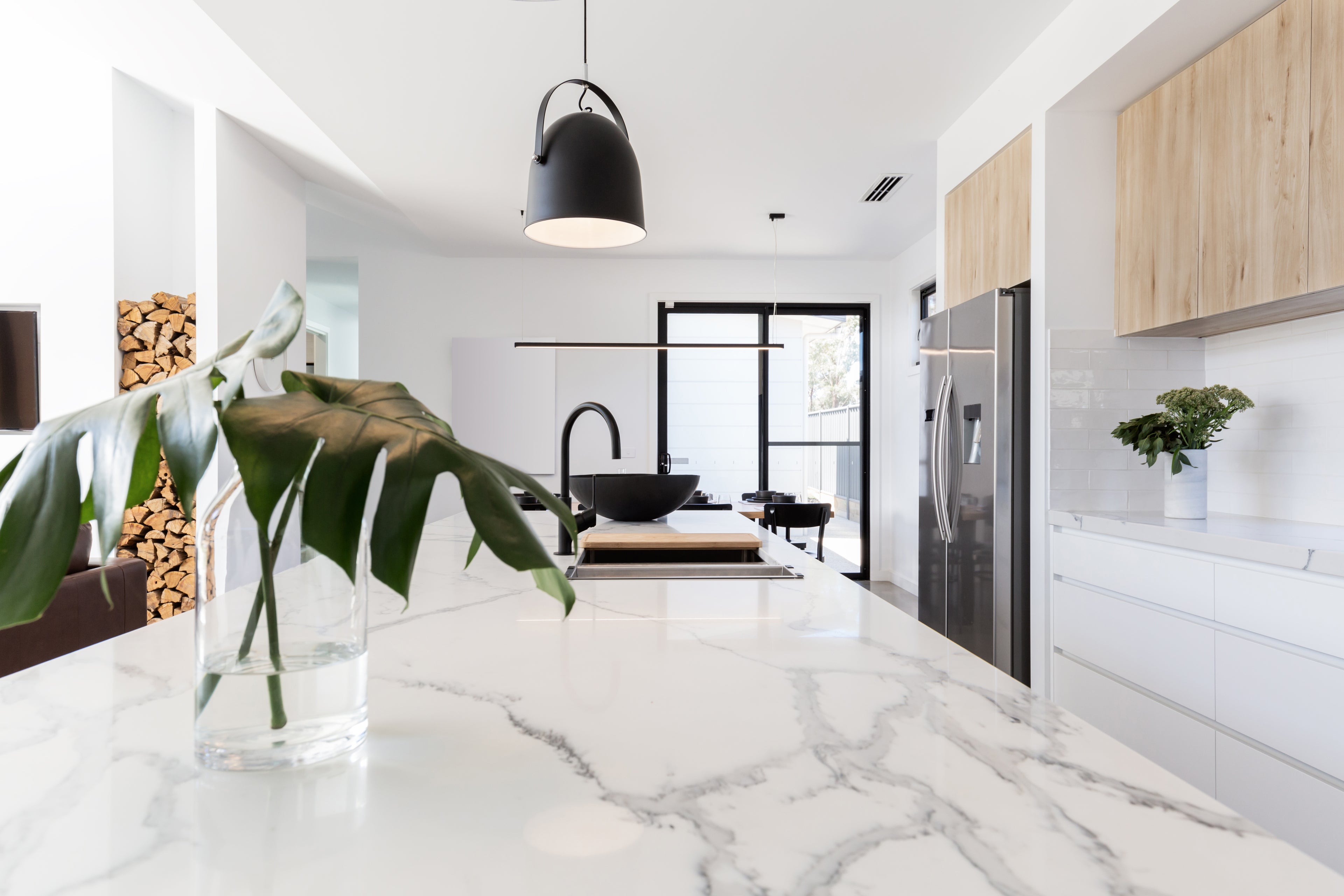 Modern kitchen interior in a spacious, well-lit home—highlighting the potential home improvements that veterinary professionals could undertake through refinancing their mortgage.