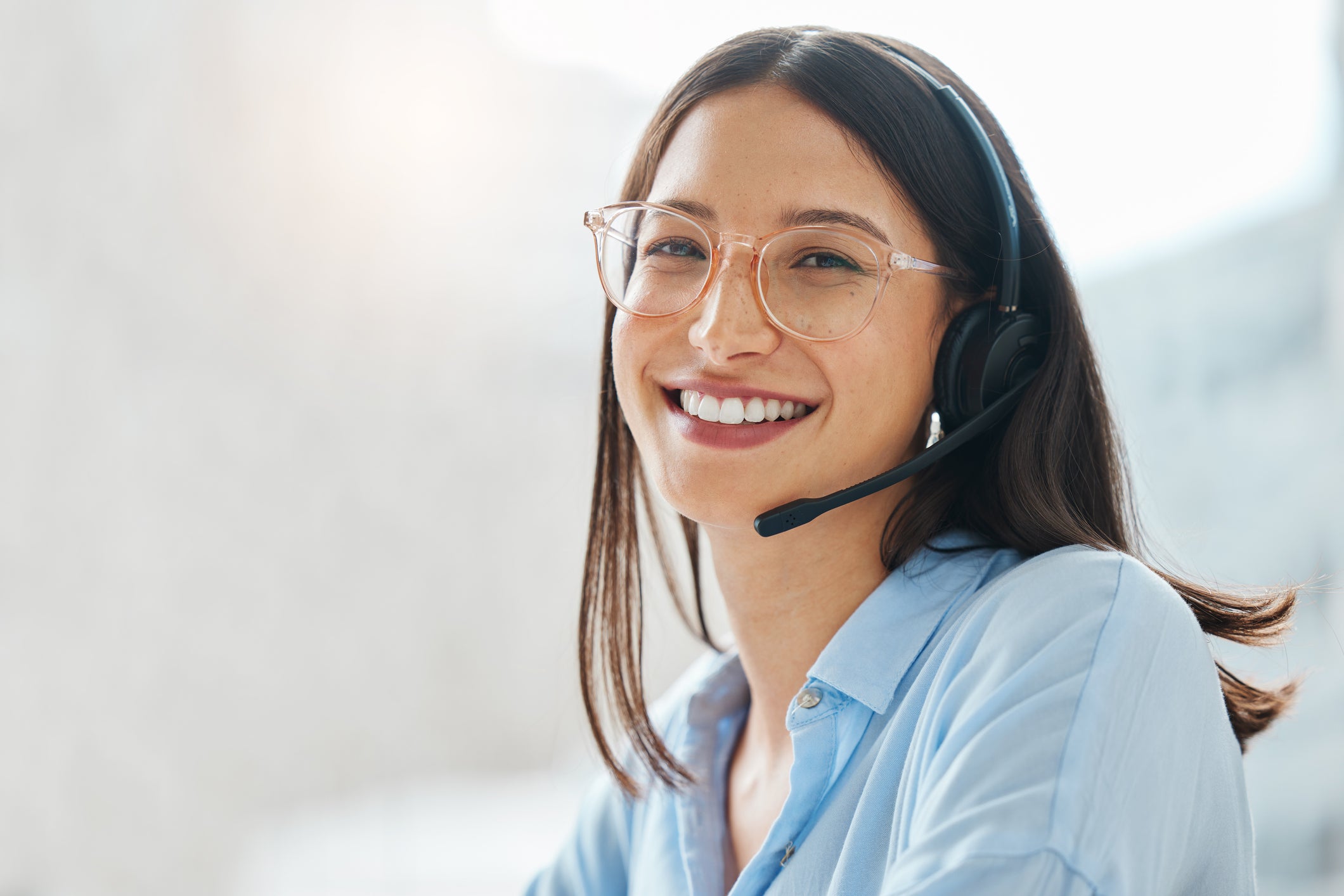 smiling woman listening to client