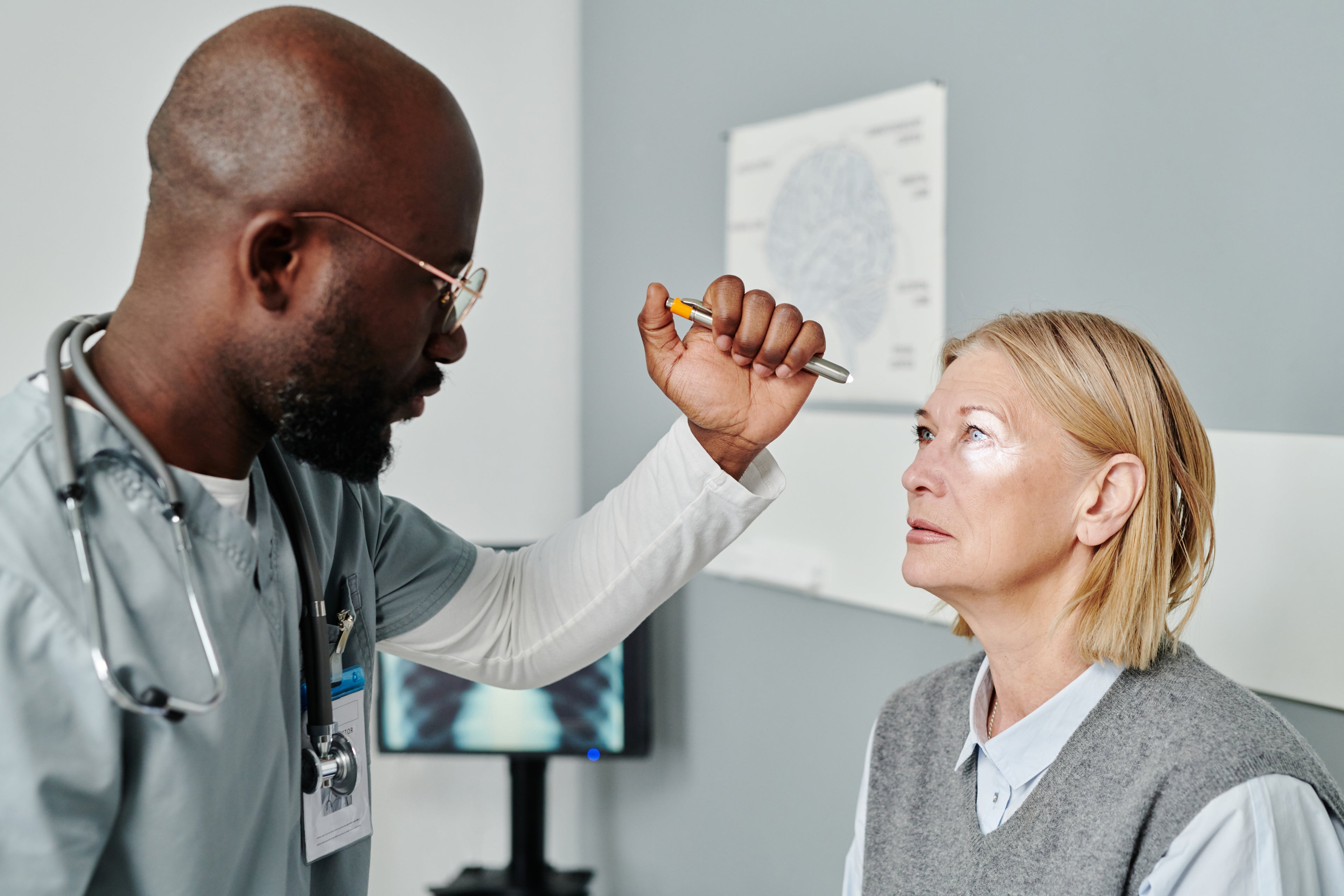 Doctor checking eye of patient