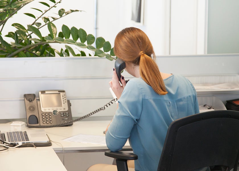 Lady-on-telephone-at-computer