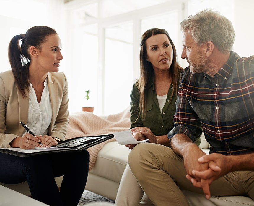 Adults sitting and talk with paperwork