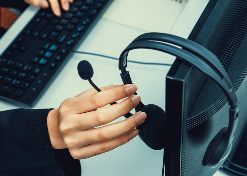 Person-with-headset-and-computer