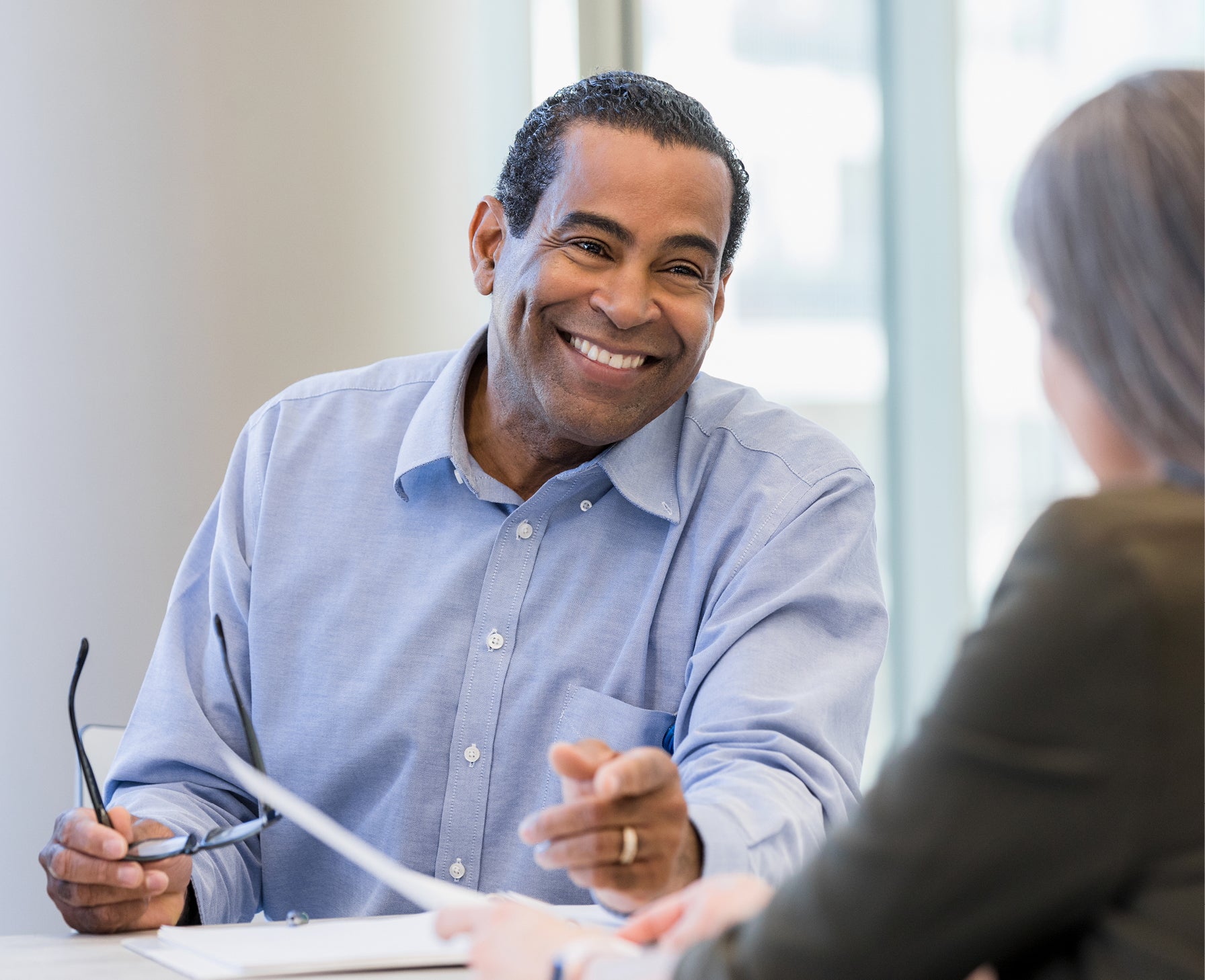 doctor smiling and talking with patient